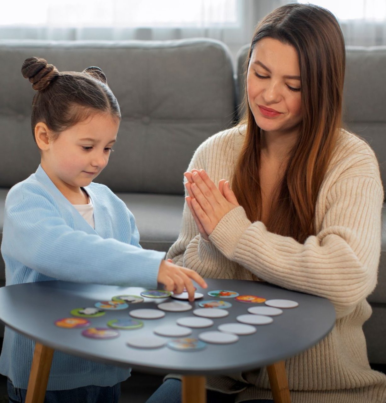 front-view-mother-girl-playing-game